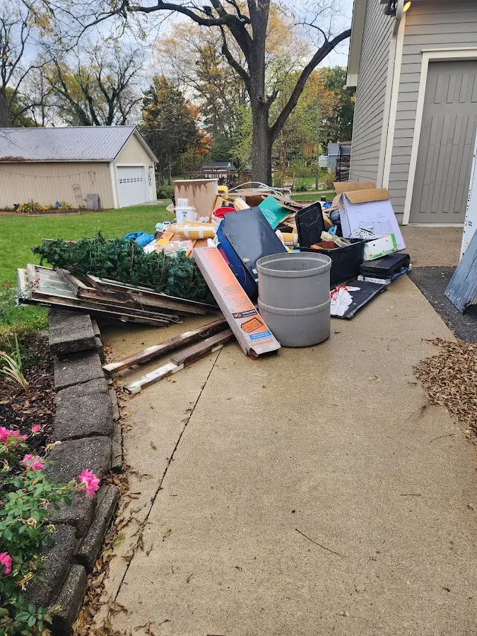 Dumpster being loaded with debris for Residential Dumpster Rental in Ada